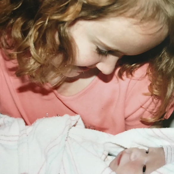 Ellen holding Charlie as a newborn.